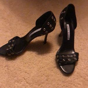 Stylish  black  heels with silver hardware..